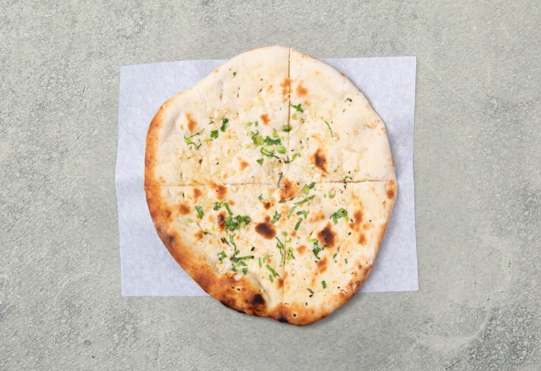 24d32e46-77f9-11ee-9af9-b6922d080ff8_garlic_naan_photoroom.png