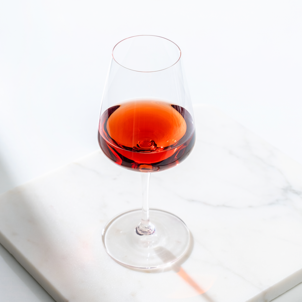 Firefly Pinot Noir A Glass Of Red Wine On A White Marble Surface, Soft Natural Light, Food 49606